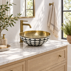 Black and White Scallop Brass Vessel Sink in a bright, airy bathroom
