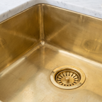 Close-up of welded brass corner and brass basket strainer