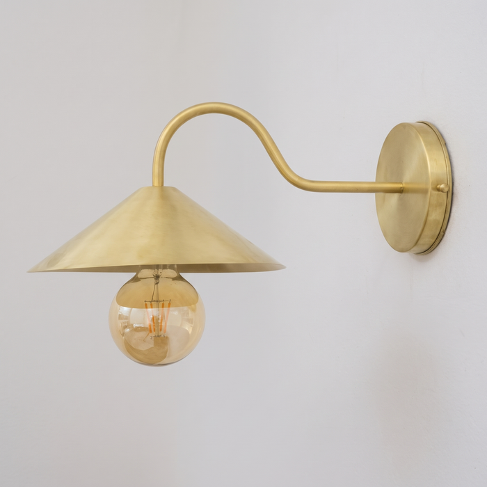 Brushed brass gooseneck wall sconce with cone shade, side view