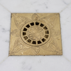 Close view of the engraved floral grate centre and slots