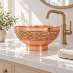 Engraved Copper Pedestal Vessel Sink installed in a bright bathroom
