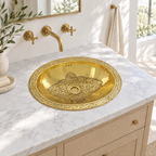 Bright California bathroom with an engraved oval brass drop-in sink