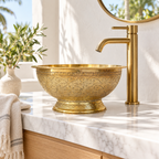 Engraved Round Brass Vessel Sink on Pedestal Foot on a marble vanity in a bright California bathroom