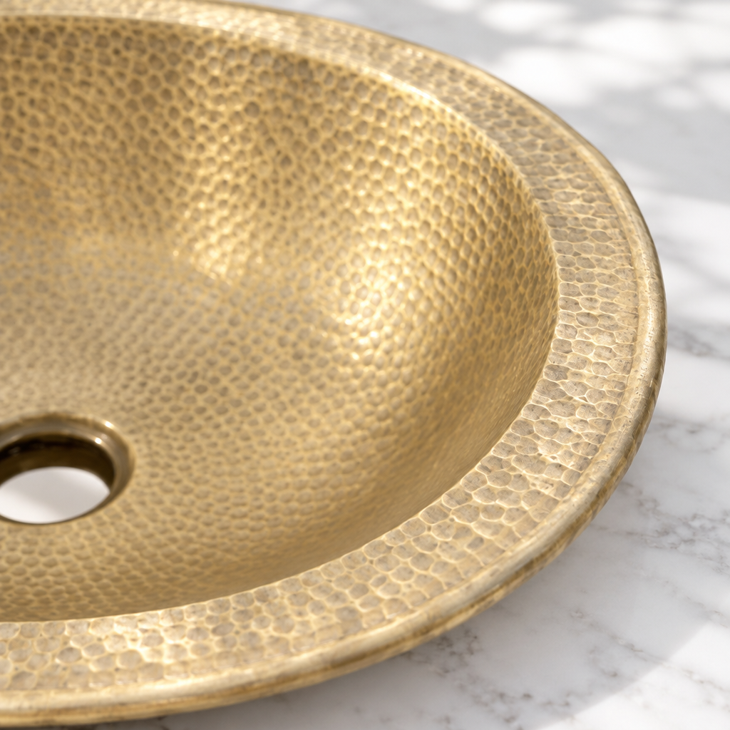 Hammered Oval Brass Drop-In Bathroom Sink, close-up of the wide rim and hammered texture