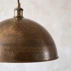 Close-up of the hand-hammered antique bronze dome texture