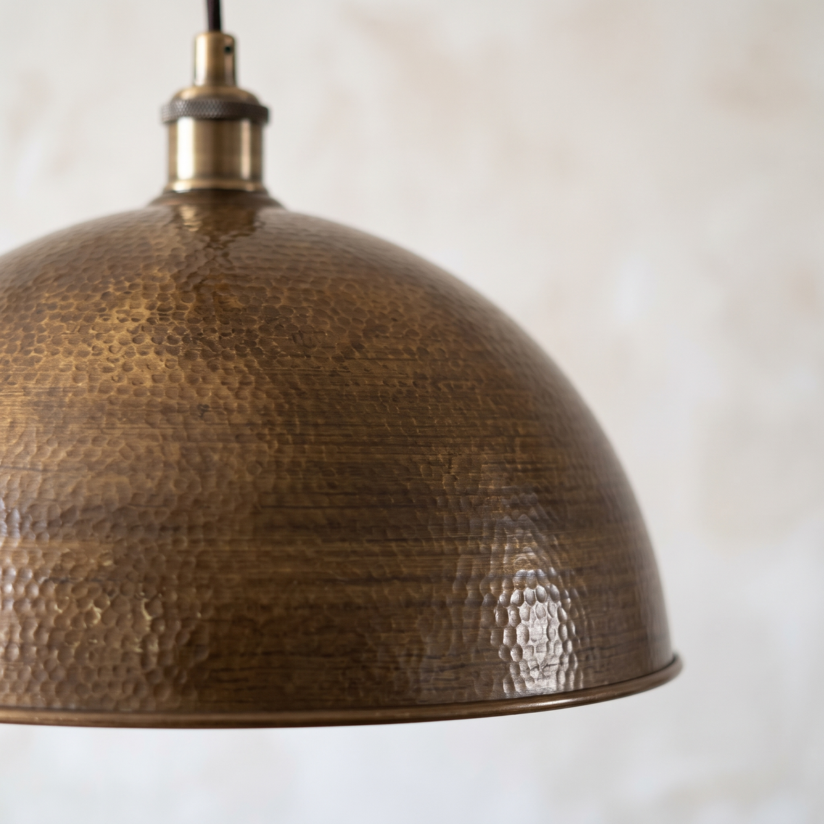 Close-up of the hand-hammered antique bronze dome texture