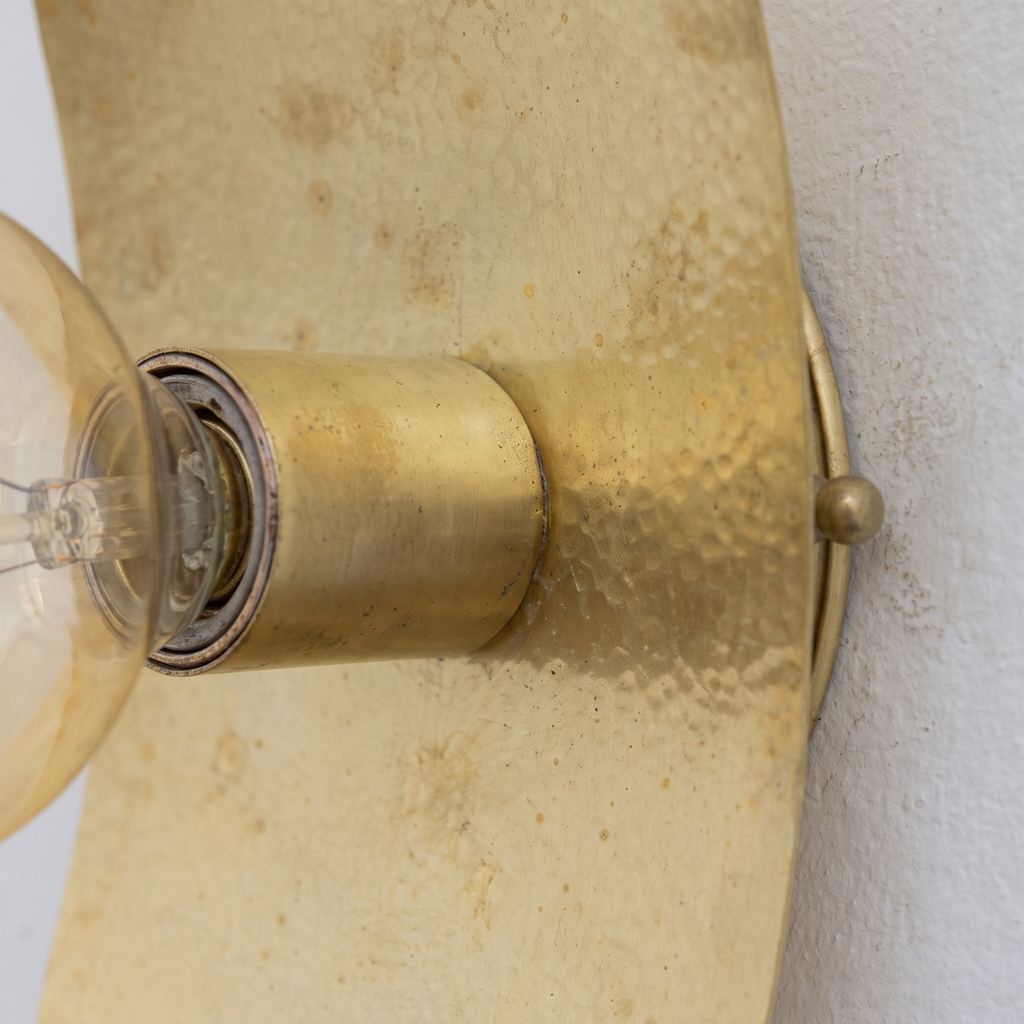 Close-up of the softly hammered unlacquered brass plate and socket