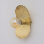 Hammered unlacquered brass oval plate wall sconce with globe bulb