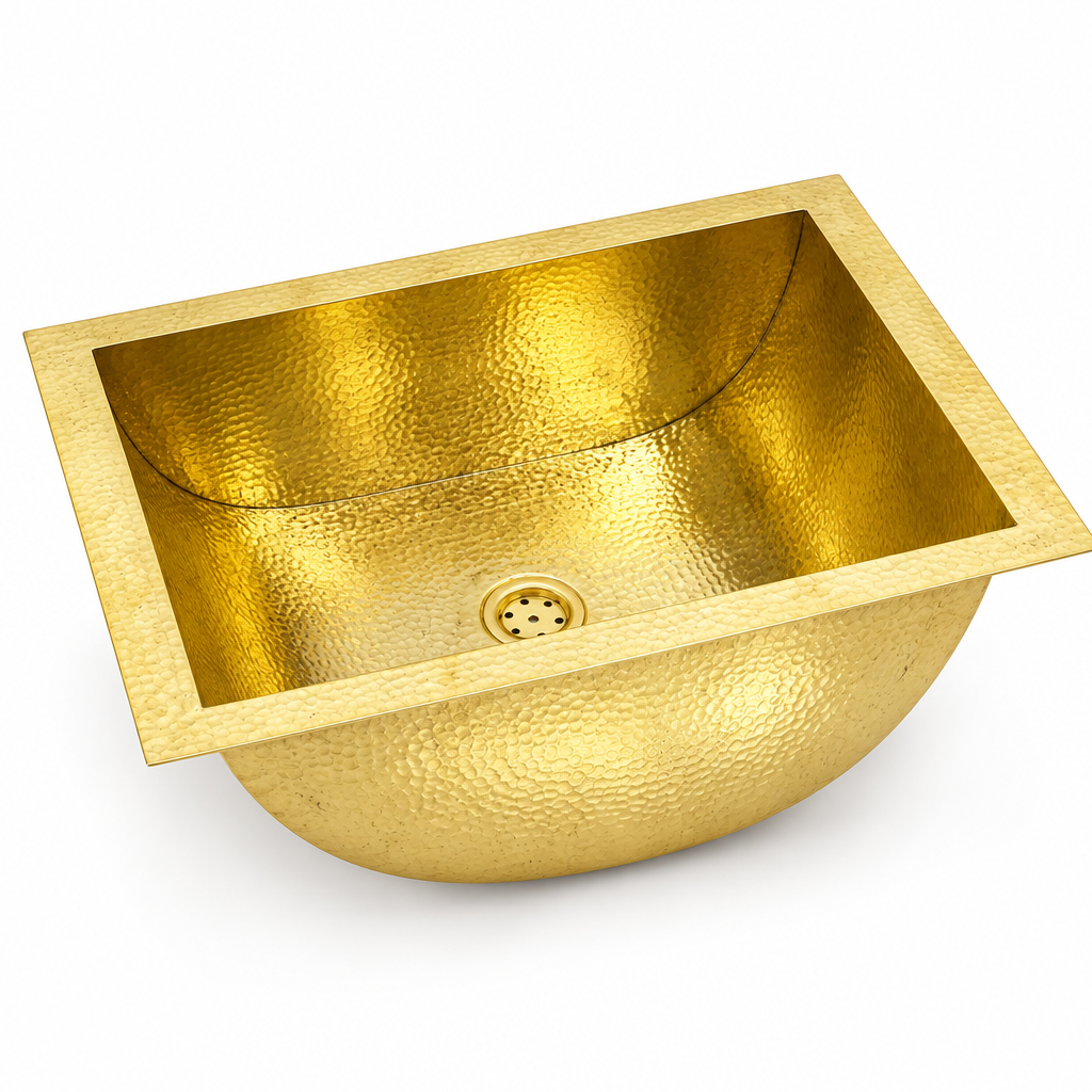 Hammered brass rectangular undermount sink with curved basin on white