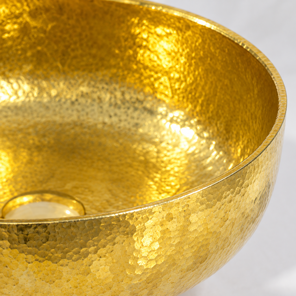 Close-up of the fine hand-hammered brass texture and thin rim