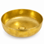 Hammered brass round vessel sink on a white background