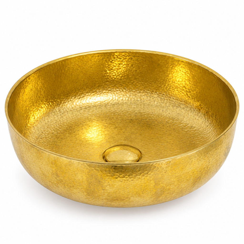 Hammered brass round vessel sink on a white background