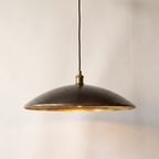 Hammered dark bronze saucer pendant light with brass interior