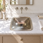 Bright California powder room with a hammered German silver drop-in sink