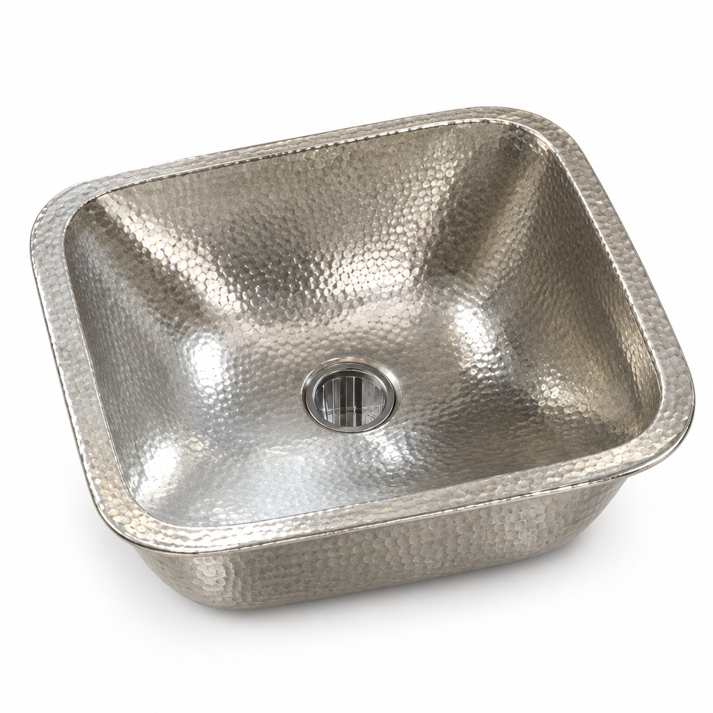 Hammered German silver rectangular drop-in sink on a white background