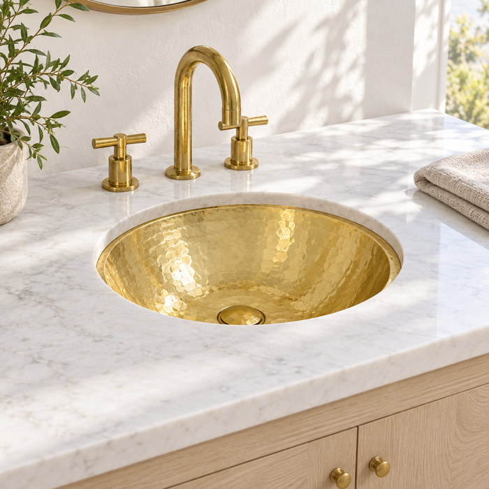 Hammered Round Brass Undermount Bathroom Sink installed in a bright bathroom