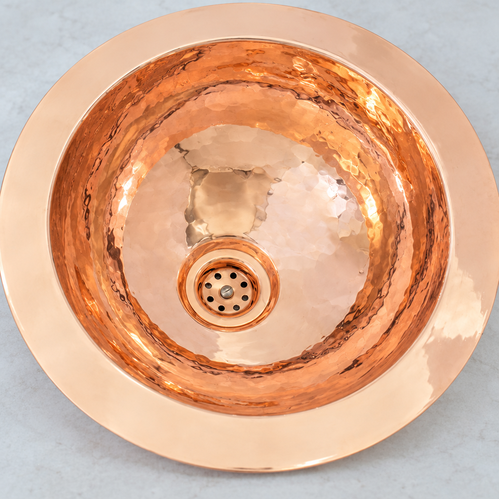 Close-up of the hand-hammered copper bowl and drain