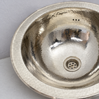 Close-up of the wide rim and hand-hammered German silver bowl