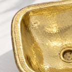 Hammered Square Brass Drop-In Bathroom Sink close-up of the rounded rim and hammered brass