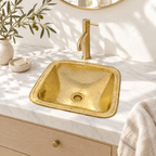 Hammered Square Brass Drop-In Bathroom Sink in a white marble vanity in a bright California bathroom