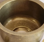 Close-up of the hammered inside of the brass bar sink