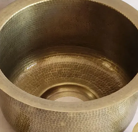 Close-up of the hammered inside of the brass bar sink