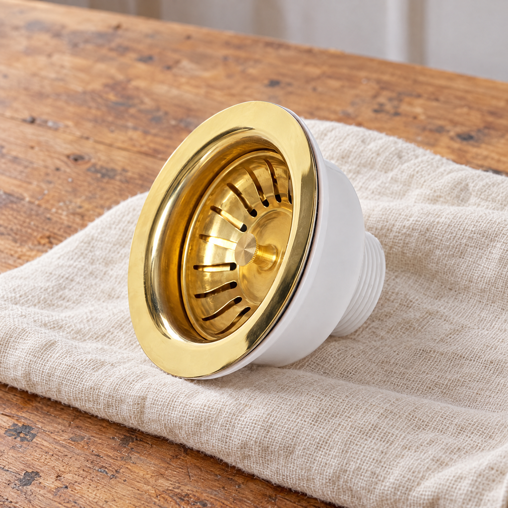 Unlacquered brass sink strainer on a linen cloth