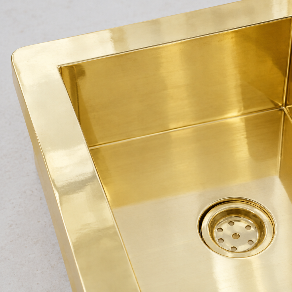 Close-up of a sealed corner and polished brass wall