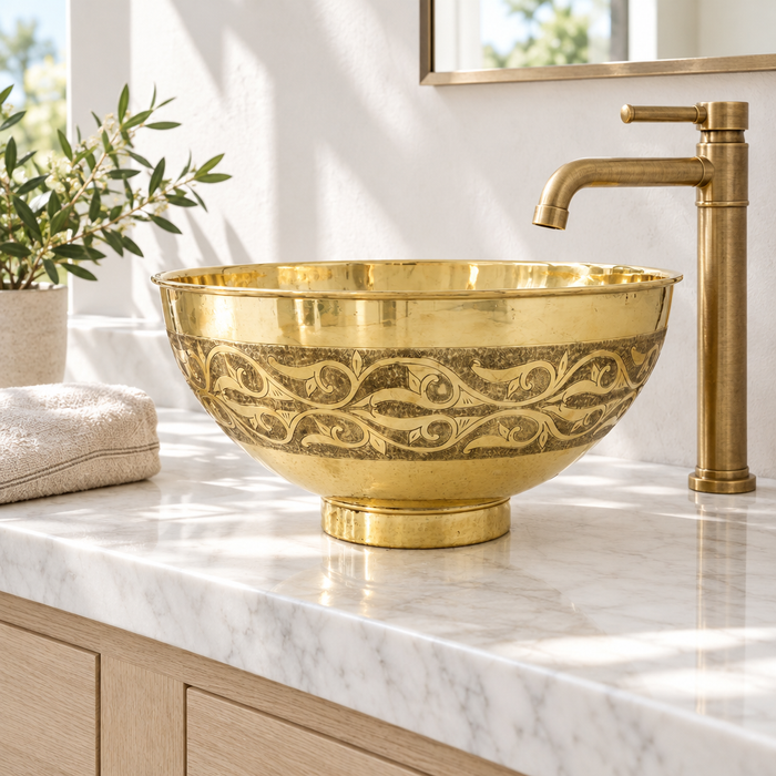 Vine Engraved Brass Bowl Vessel Sink installed in a bright bathroom
