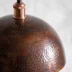 Fine hand-hammered texture of the vintage oxidized copper dome